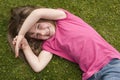 Little girl laying in grass Royalty Free Stock Photo