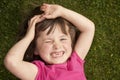 Little girl laying in grass Royalty Free Stock Photo