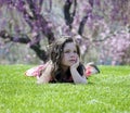 Little girl laying in the grass Royalty Free Stock Photo