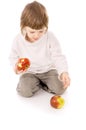 The little girl leads a healthy way of life, and eat apples Royalty Free Stock Photo