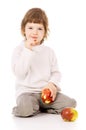 The little girl leads a healthy way of life, and eat apples Royalty Free Stock Photo