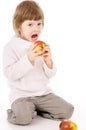 The little girl leads a healthy way of life, and eat apples Royalty Free Stock Photo