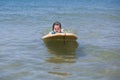 Little girl learn to surf at ocean