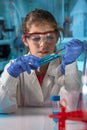 Little girl learning science chemical in the class in the laboratory of school