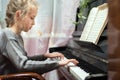 Little girl play the piano.