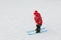 Little girl learning to ski in winter