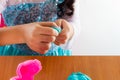 Little girl is learning to use colorful play dough Royalty Free Stock Photo