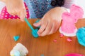 Little girl is learning to use colorful play dough Royalty Free Stock Photo