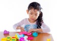 Little girl is learning to use colorful play dough Royalty Free Stock Photo