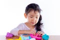 Little girl is learning to use colorful play dough Royalty Free Stock Photo