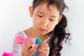 Little girl is learning to use colorful play dough
