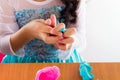 Little girl is learning to use colorful play dough Royalty Free Stock Photo
