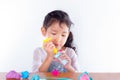 Little girl is learning to use colorful play dough Royalty Free Stock Photo