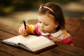 Little girl learning to write Royalty Free Stock Photo