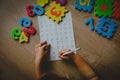 Little girl learning write and culculate numbers Royalty Free Stock Photo