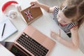 Little girl learns foreign languages on laptop