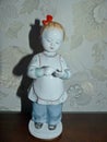 A little girl learns to count. Retro porcelain figurine, collection.