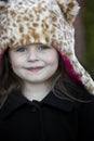 Little girl in leopard fake fur hat Royalty Free Stock Photo