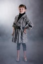 Little girl in leopard print coat