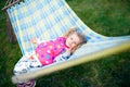 Little girl lies on a hammock Royalty Free Stock Photo