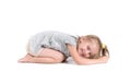 Little girl lies on studio floor Royalty Free Stock Photo