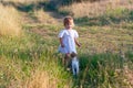 Little girl in the light dress with cat Royalty Free Stock Photo