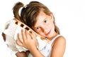 Little girl listening a huge seashell isolated Royalty Free Stock Photo