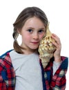 Little girl listening a shell Royalty Free Stock Photo