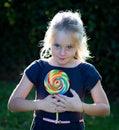 Little girl with lollipop candy Royalty Free Stock Photo