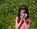 Little girl with long brown hair with allergy to the grasses blo Royalty Free Stock Photo