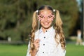 Little girl long hair hold star eyewear booth props, happy holidays concept Royalty Free Stock Photo