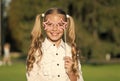 Little girl long hair hold star eyewear booth props, happy holidays concept Royalty Free Stock Photo