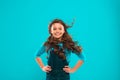 Little girl with long hair. Kid happy cute face with adorable curly hair stand over blue background. Pure beauty. Beauty Royalty Free Stock Photo