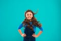 Little girl with long hair. Kid happy cute face with adorable curly hair stand over blue background. Pure beauty. Beauty Royalty Free Stock Photo