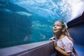 Little girl looking at fish tank Royalty Free Stock Photo