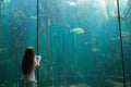 Little girl looking at fish tank Royalty Free Stock Photo