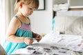 Little girl looking her family photo in album Royalty Free Stock Photo