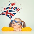 Little girl looking at i love english text and UK flag above her head