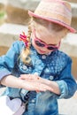 Little girl is looking at ladybug Royalty Free Stock Photo