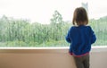 Little girl looking out of the window Royalty Free Stock Photo