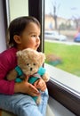 Little girl looking out the window Royalty Free Stock Photo