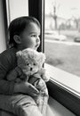 Little girl looking out the window Royalty Free Stock Photo