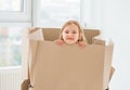 Little girl looking outside of the box Royalty Free Stock Photo