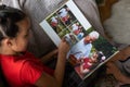 Little girl looking photobook at home. Close up shot. Family, childhood and leisure concept Royalty Free Stock Photo