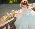 Little girl looking through vintage balkony