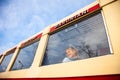 Little girl looking at window of old Georgian train Kukushka, view from outside