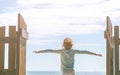 Little girl looks away in the background of the blue sky Royalty Free Stock Photo