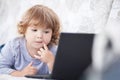 Smart toddler girl using her laptop computer, child and technolo. Royalty Free Stock Photo