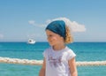 Little girl looks out to sea. Royalty Free Stock Photo