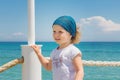 Little girl looks out to sea. Royalty Free Stock Photo